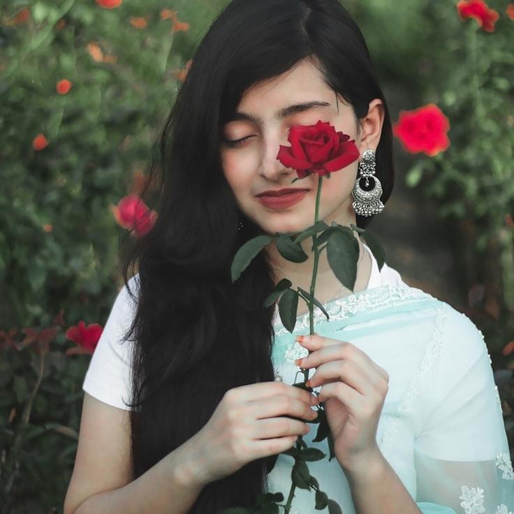 Kaveri Mehta, Lead Design Curator at GranitePathWay, reviewing corporate floral arrangements